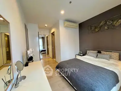 Modern bedroom with stylish decor and ample natural light