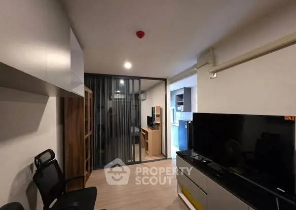 Modern living room with sleek TV setup and stylish furniture
