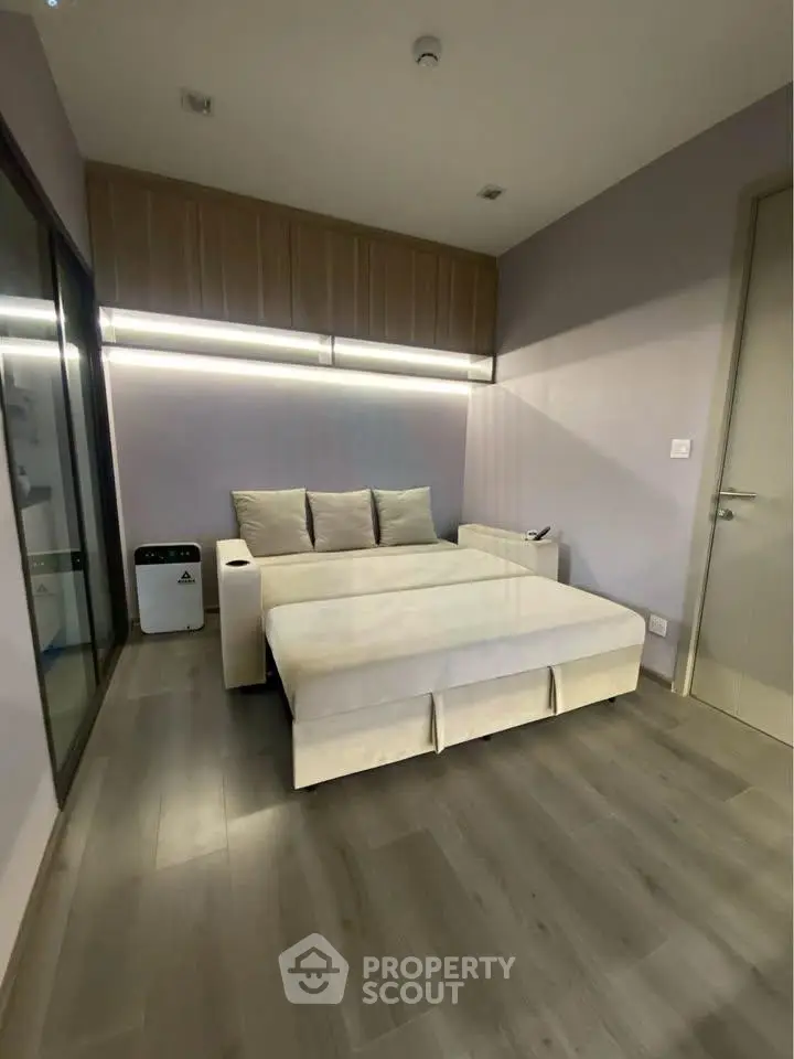 Modern living room with sleek design and cozy sofa bed, perfect for urban living.