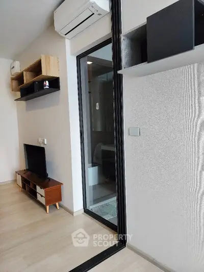 Modern living room with sleek design and air conditioning unit