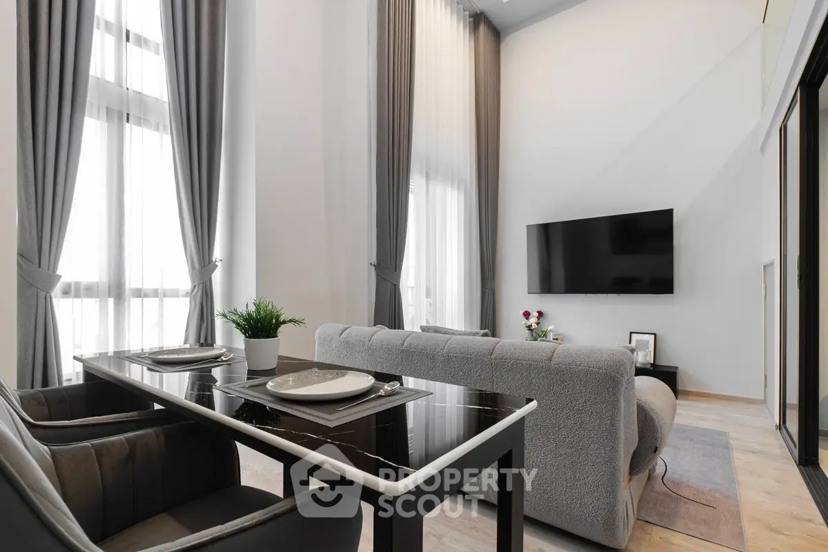 Modern living room with high ceilings and elegant decor