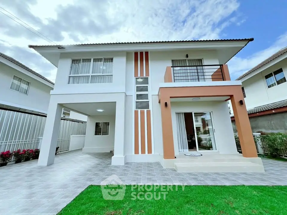 Modern two-story house with clean design and spacious driveway