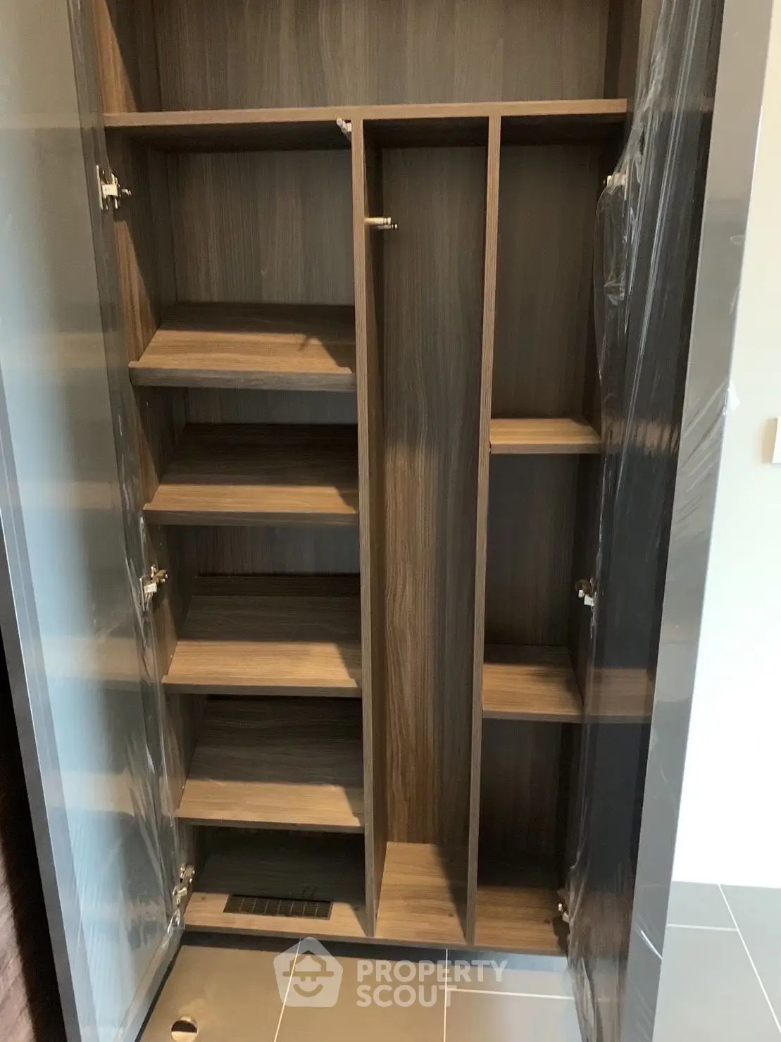 Spacious wooden storage cabinet with multiple shelves in modern interior