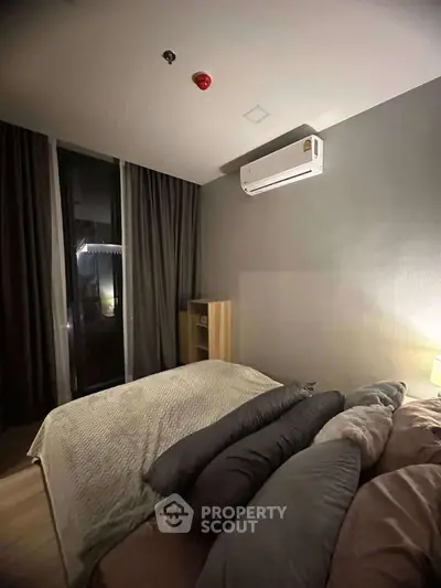 Cozy bedroom with modern air conditioning and elegant lighting