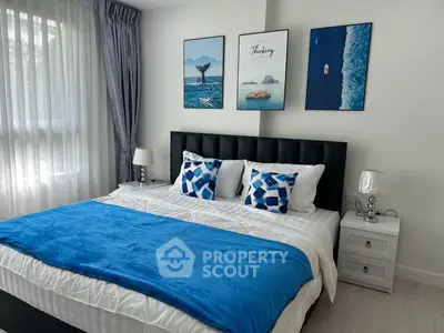 Stylish bedroom with modern decor and large window for natural light