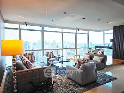 Luxurious living room with panoramic city views and modern furnishings