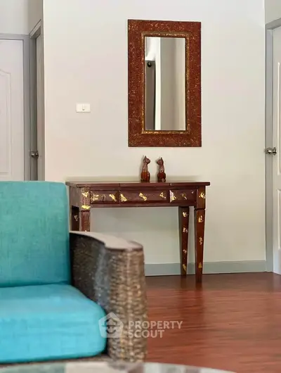 Elegant living room with stylish furniture and decorative mirror