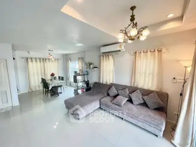 Spacious living room with modern decor and ample natural light