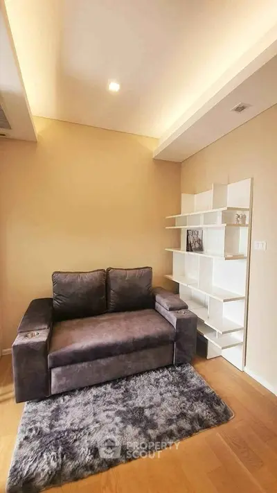 Modern living room with cozy sofa and stylish shelving unit
