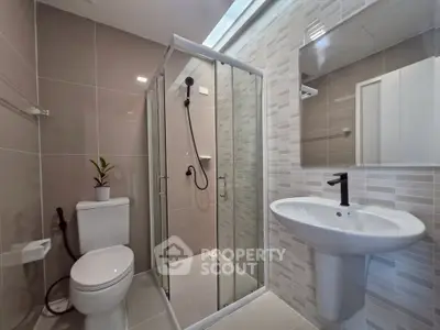 Modern bathroom with sleek shower and elegant fixtures
