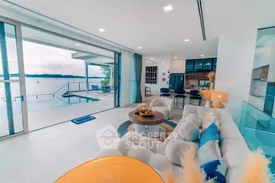 Luxurious open-plan living room with stunning ocean view and modern decor