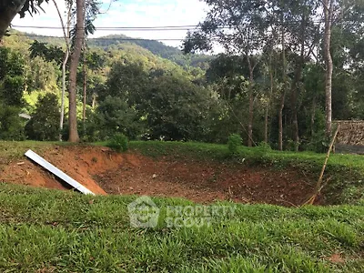 Scenic view of a lush green landscape with a large excavation site, ideal for future development.