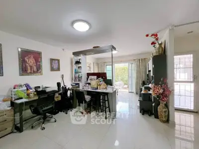 Spacious living room with modern decor and natural light, ideal for family gatherings.