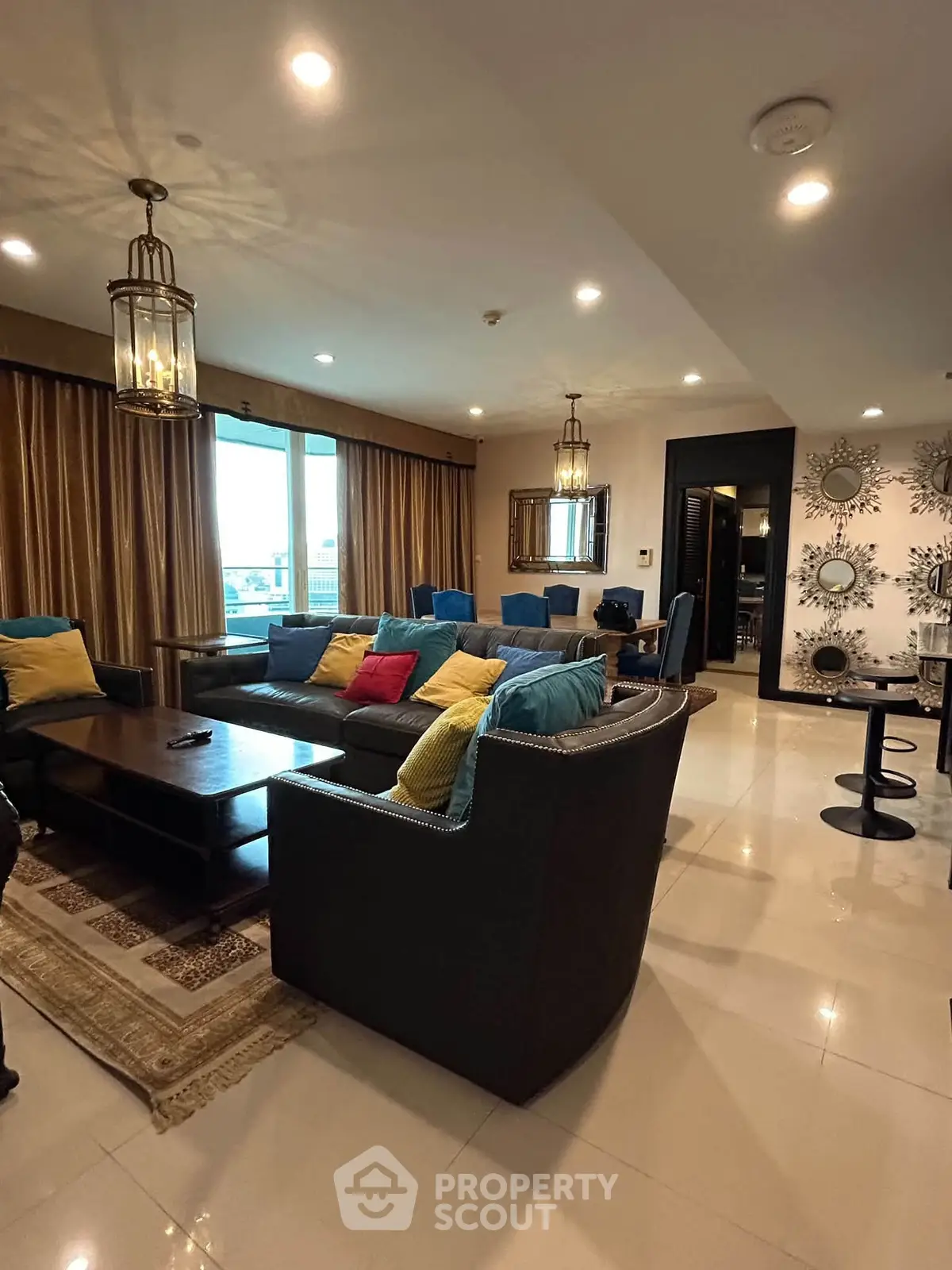 Luxurious living room with elegant decor and spacious seating area, perfect for relaxation and entertainment.