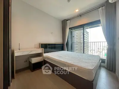 Modern bedroom with balcony view in high-rise apartment