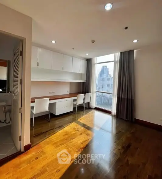 Spacious study room with city view and elegant wooden flooring