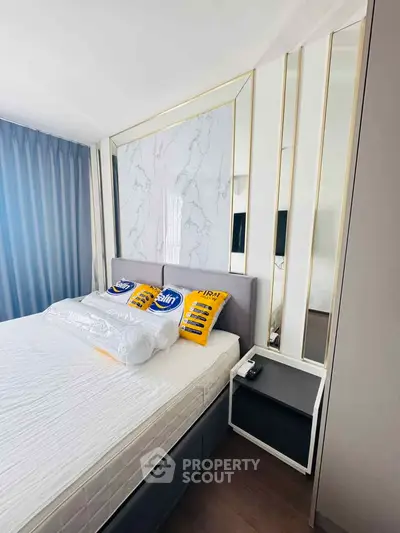 Modern bedroom with stylish decor and elegant headboard design