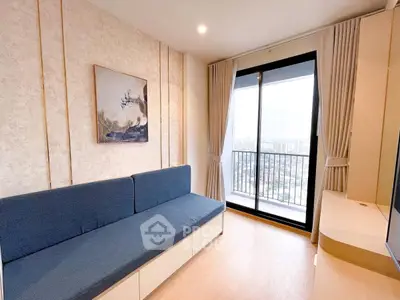 Modern living room with stylish decor and balcony view