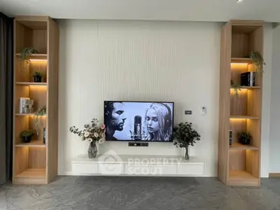 Modern living room with built-in shelves and sleek TV setup