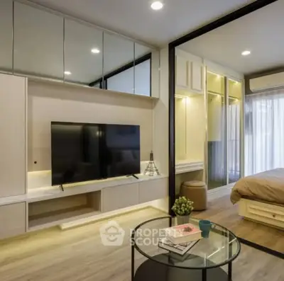 Modern living room with sleek design and integrated bedroom view