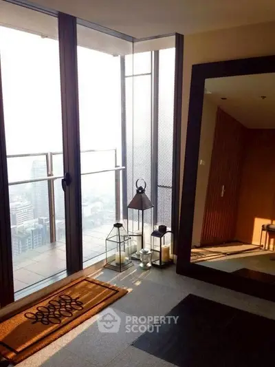 Luxurious high-rise apartment with floor-to-ceiling windows and stunning city view.