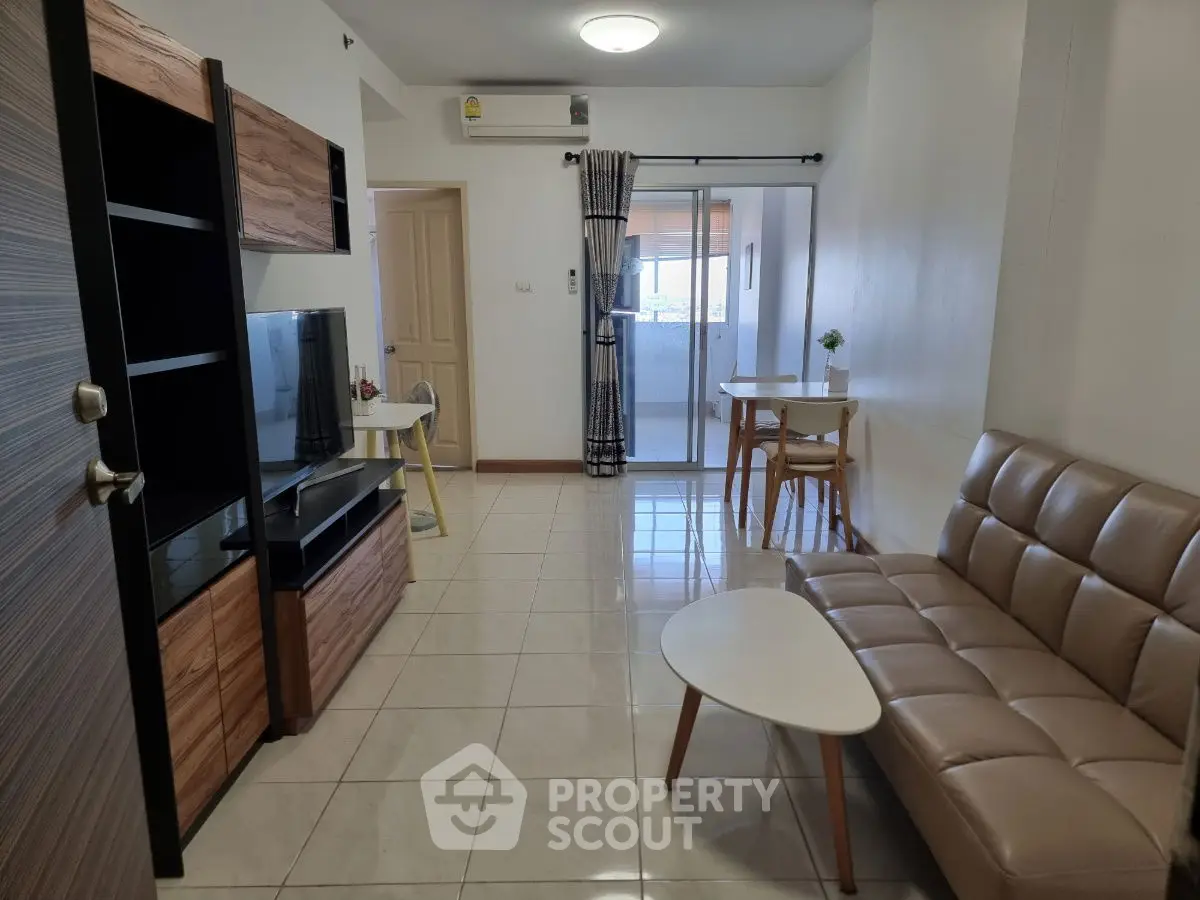 Modern living room with sleek furniture and natural light, perfect for urban living.