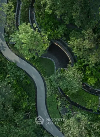 Lush garden pathway with winding design and abundant greenery, perfect for serene outdoor living.