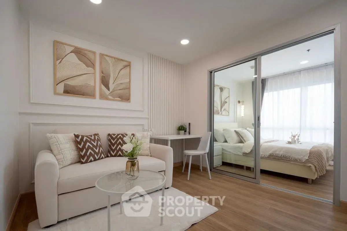 Modern living room with cozy sofa and elegant bedroom view