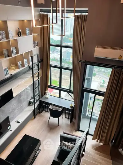 Modern loft apartment with floor-to-ceiling windows and stylish interior design.