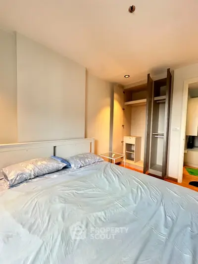 Spacious bedroom with modern closet and cozy ambiance