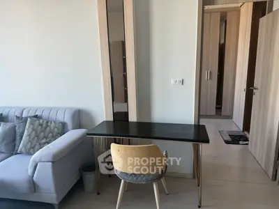 Modern living room with stylish furniture and sleek design, perfect for urban living.