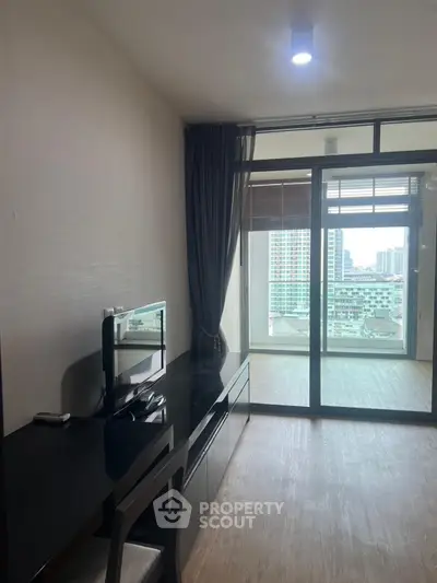 Modern apartment with sleek study area and city view balcony