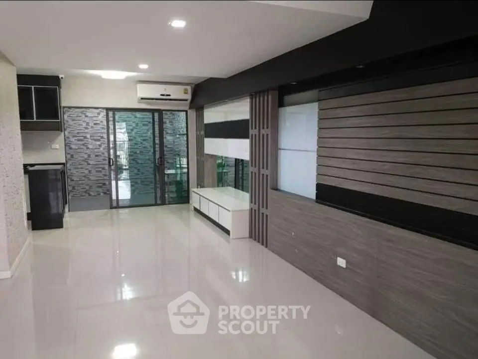Modern living room with sleek design and glass sliding doors