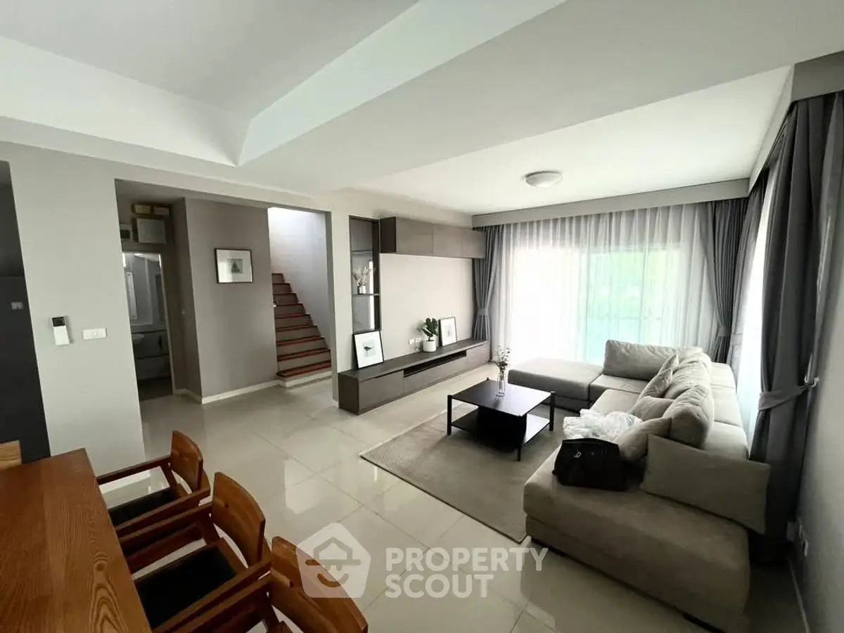 Spacious modern living room with elegant furniture and natural light