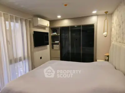 Elegant bedroom with modern decor and ample closet space