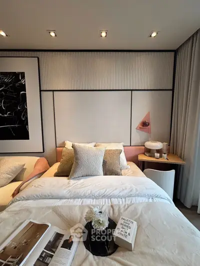 Luxurious bedroom with modern decor and plush bedding, perfect for relaxation.