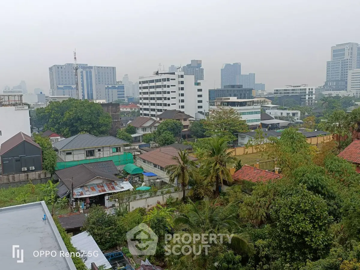Stunning cityscape view showcasing diverse architecture and lush greenery, perfect for urban living enthusiasts.