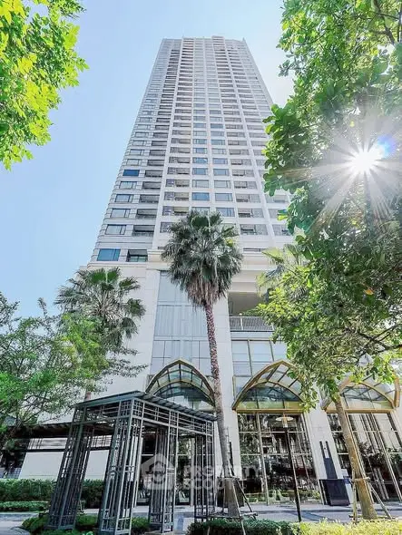 Stunning high-rise building with lush greenery and modern architecture, perfect for urban living.