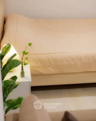 Cozy bedroom with soft lighting and minimalistic decor, perfect for relaxation.