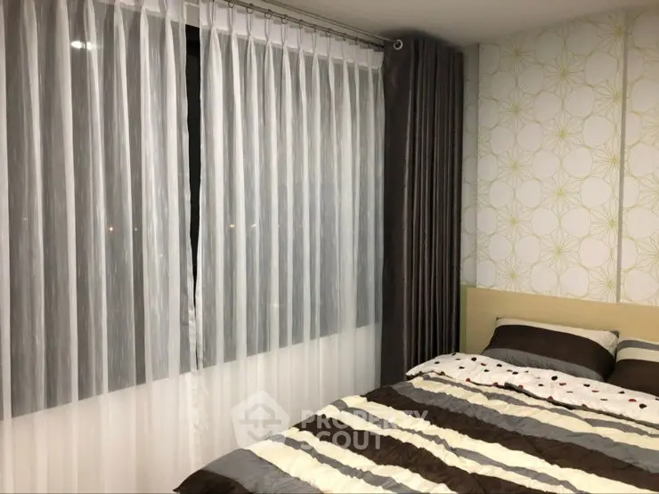 Cozy bedroom with modern decor and stylish curtains