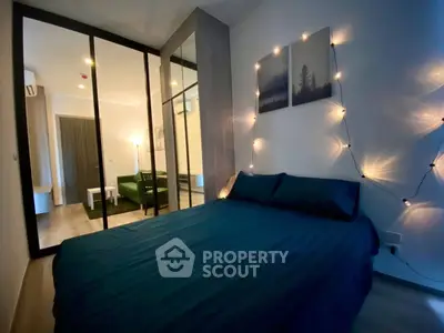 Cozy bedroom with modern decor and ambient lighting in a stylish apartment.