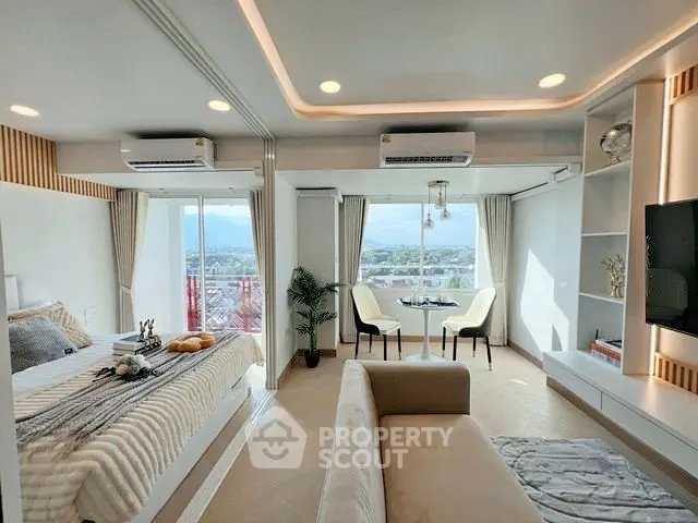 Luxurious modern studio apartment with panoramic city views and elegant interior design.