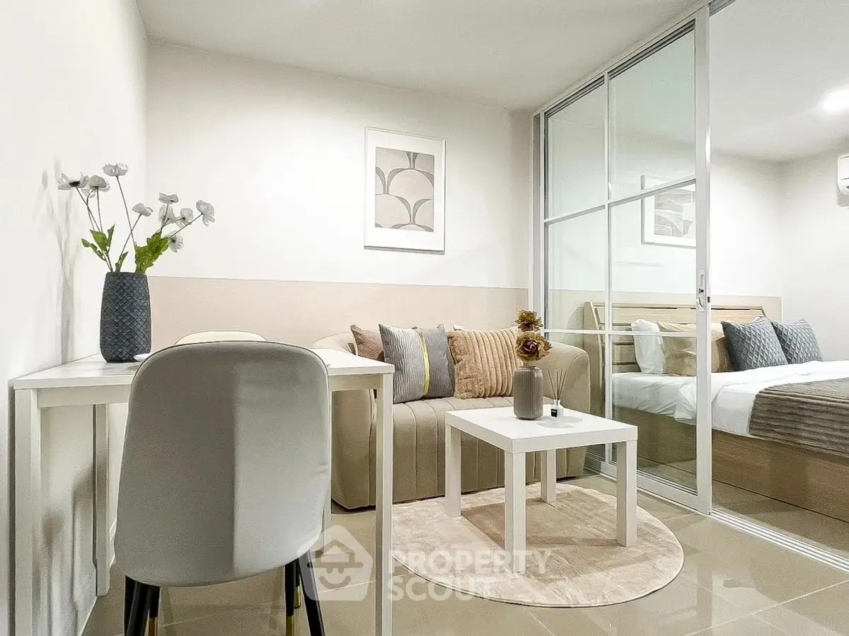 Modern living room with cozy seating and stylish decor in a contemporary apartment.