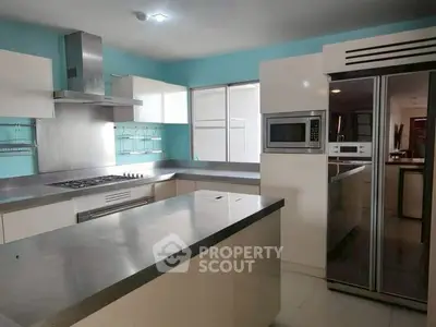 Modern kitchen with stainless steel appliances and sleek design