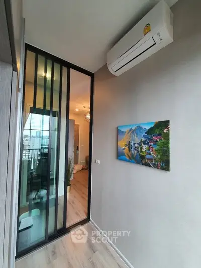 Modern apartment hallway with air conditioning and sliding glass door