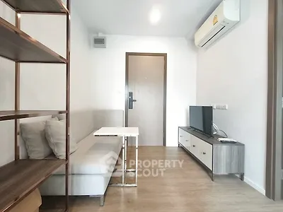 Modern living room with sleek furniture and air conditioning in a cozy apartment.