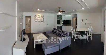 Spacious modern living room with open kitchen and stylish furniture