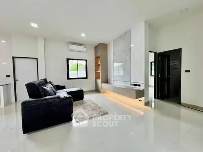 Modern living room with sleek design and cozy seating area