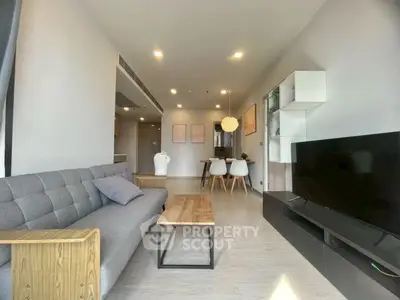 Modern living room with sleek furniture and open layout, perfect for contemporary living.