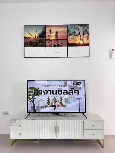 Modern living room with stylish TV stand and wall art decor